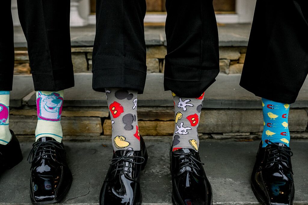 Details of the groom and his groomsmen's fun socks