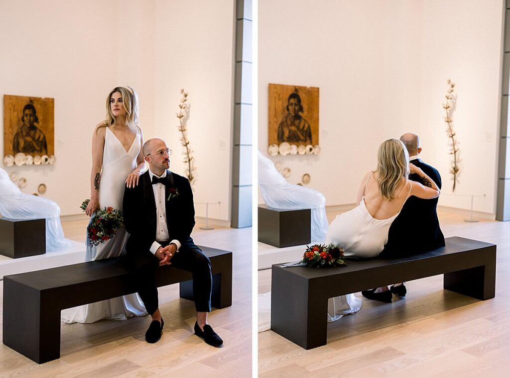 Newlyweds gaze at art on the walls from a bench at their Asheville North Carolina Art Museum Elopement 