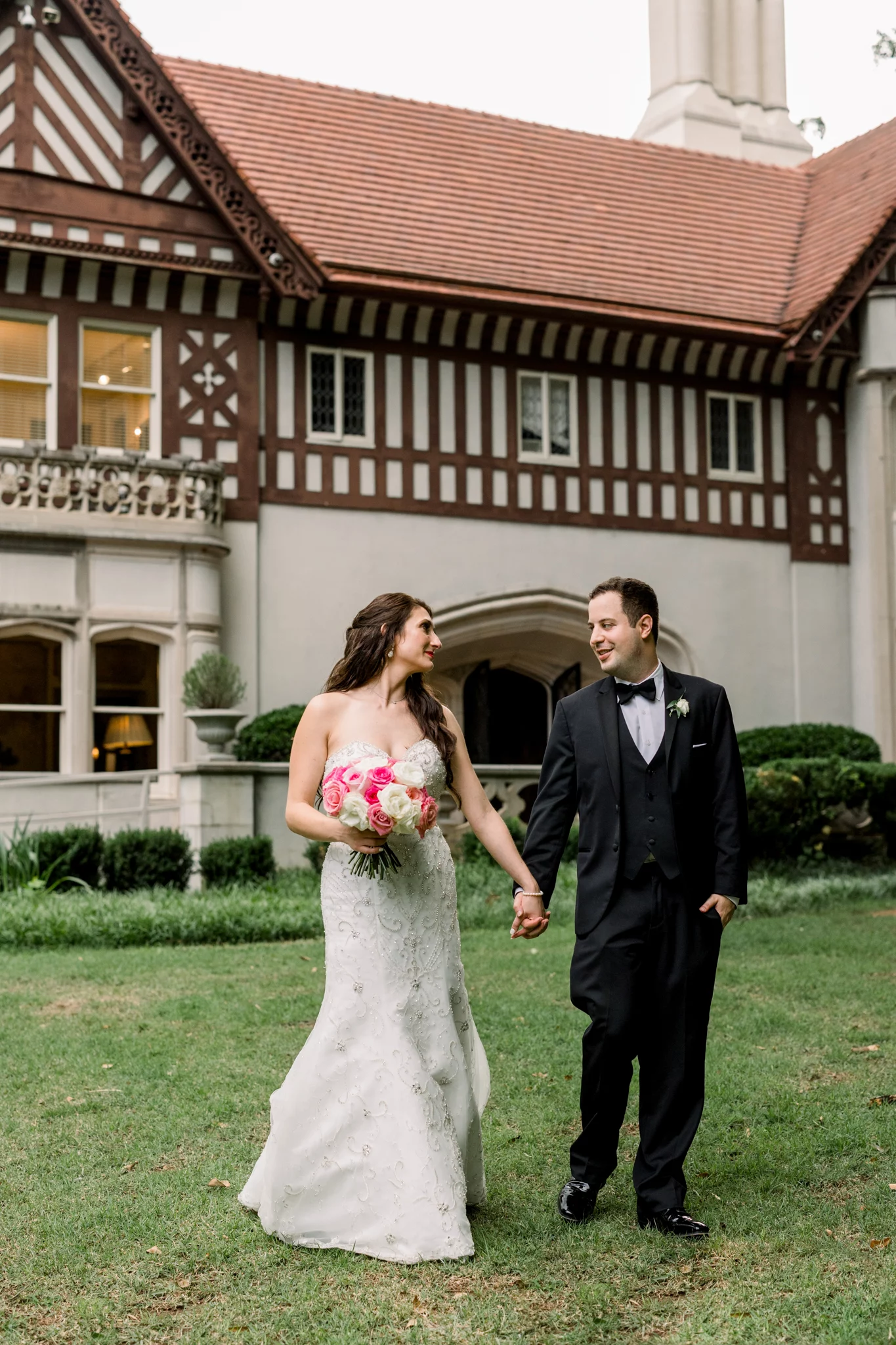 bride and groom holding hands and looking at each other at the Callanwolde Fine Arts Center Wedding venue