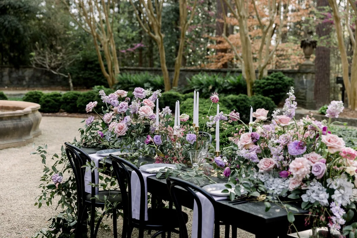 Swan House outdoor wedding reception table design with purple florals