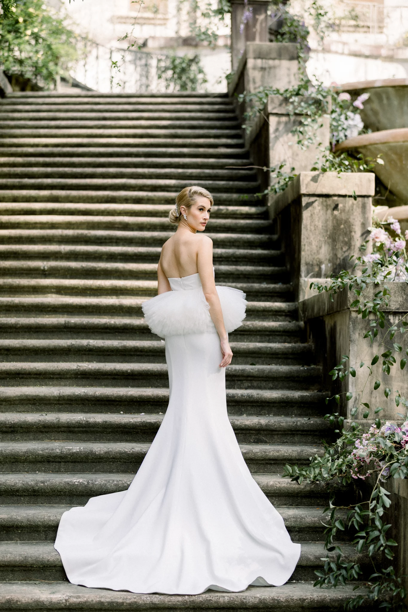 bride standing on the stairs in a luxury gown a swan house wedding in Atlanta GA