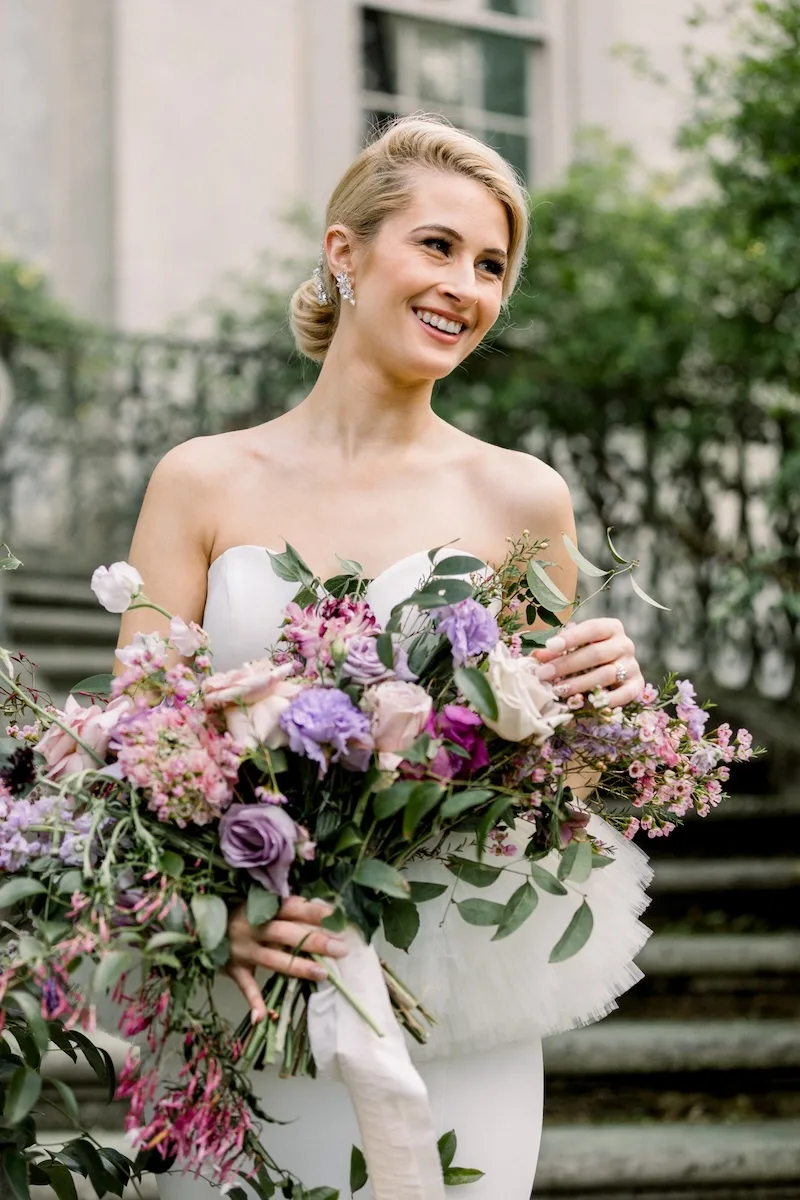 happy Swan House wedding bride with large floral bouquet