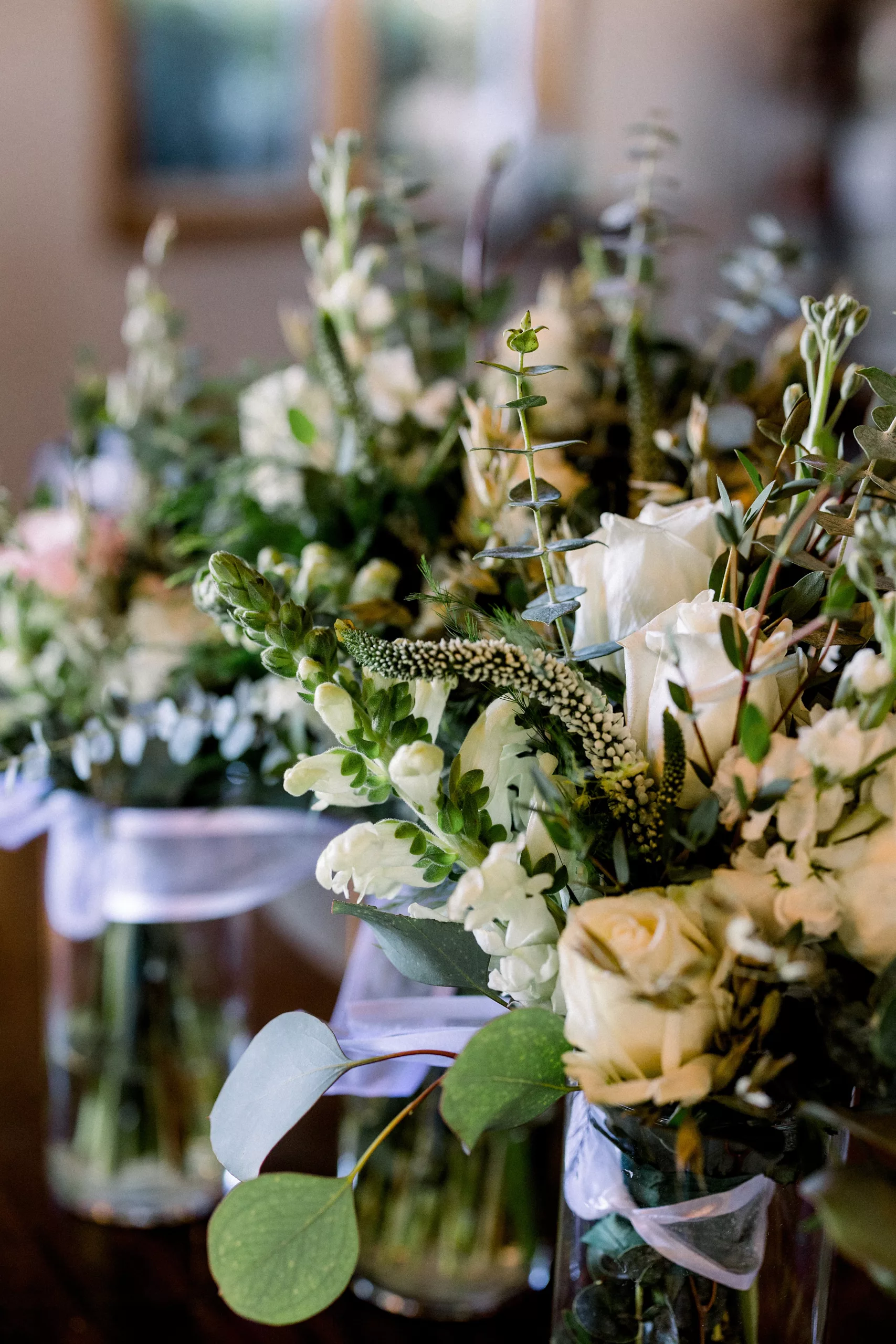 Details of centerpieces with white roses for a wedding reception