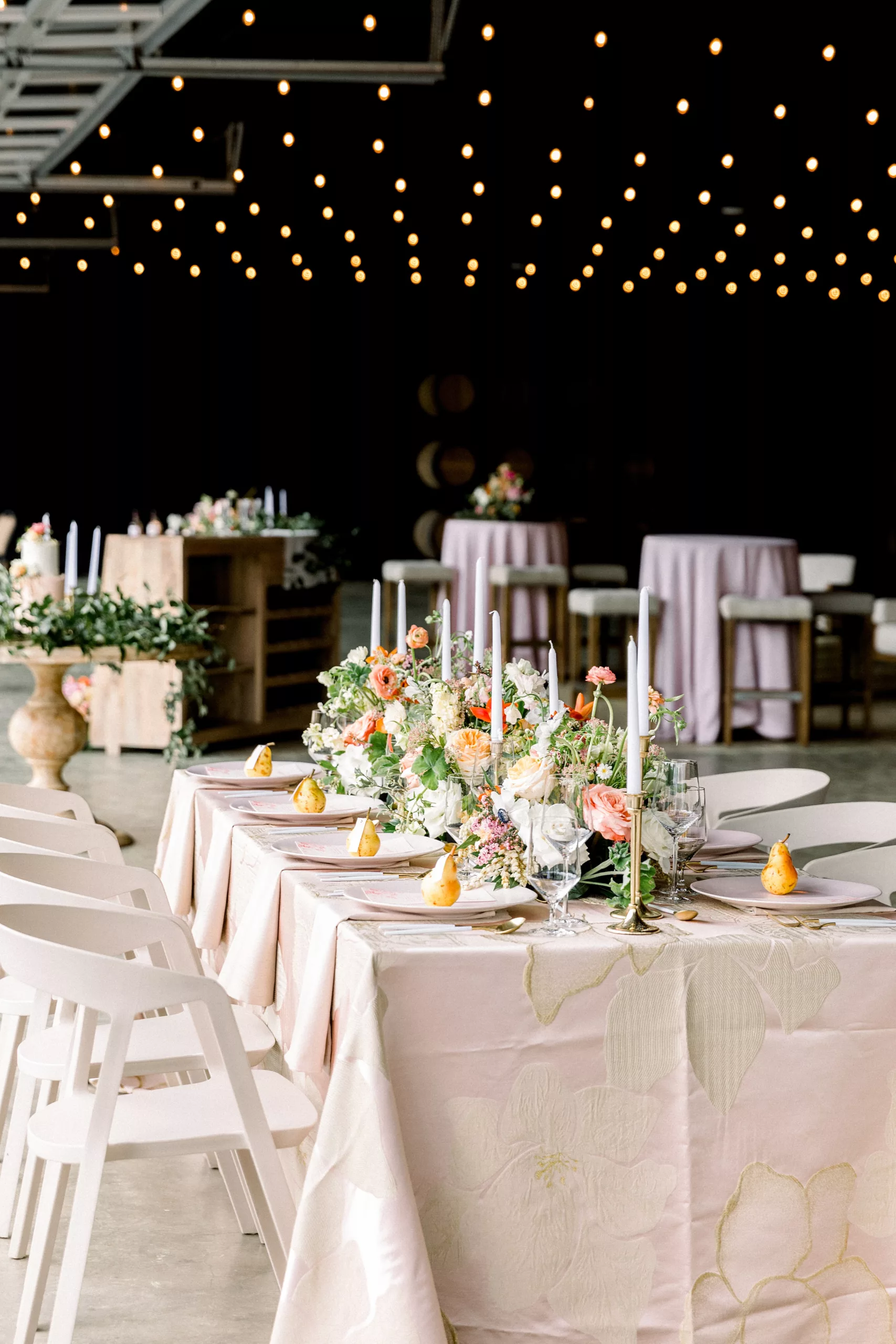 Details of a wedding reception table covered in flowers