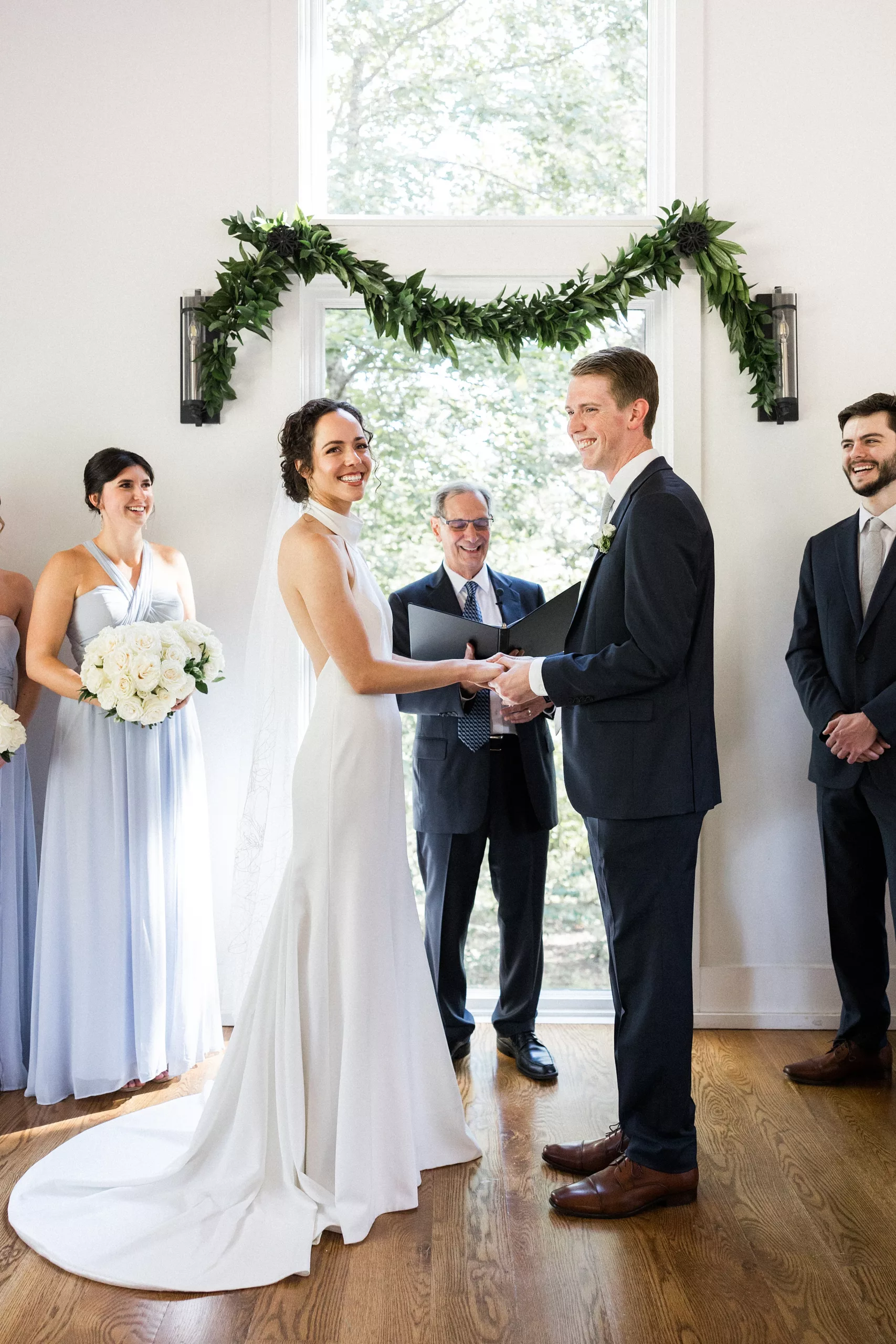 Newlyweds smile and hold hands during their ceremony at Juliette Chapel Wedding