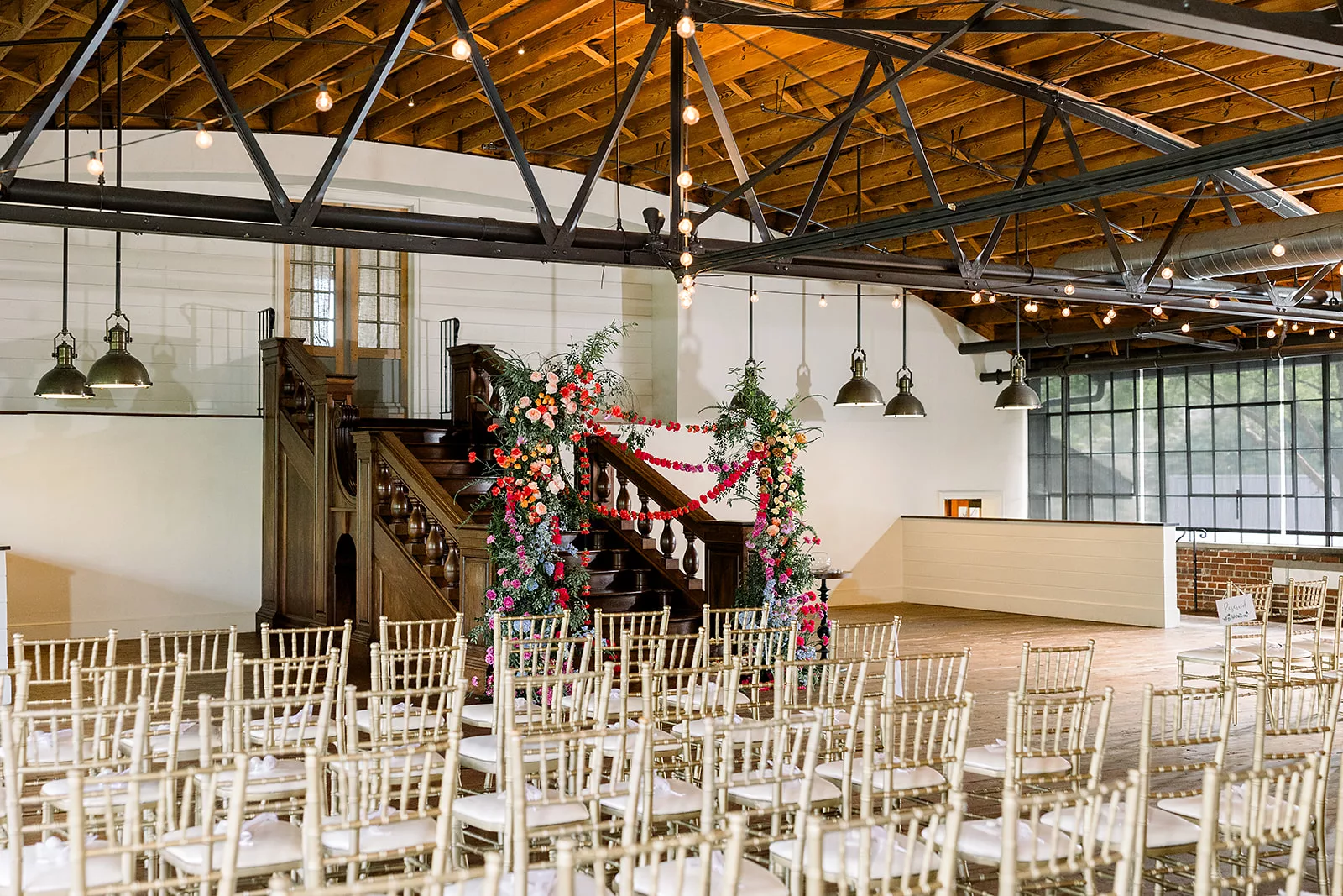 Details of a wedding ceremony set up with colorful florals at a Summerour Studio Wedding