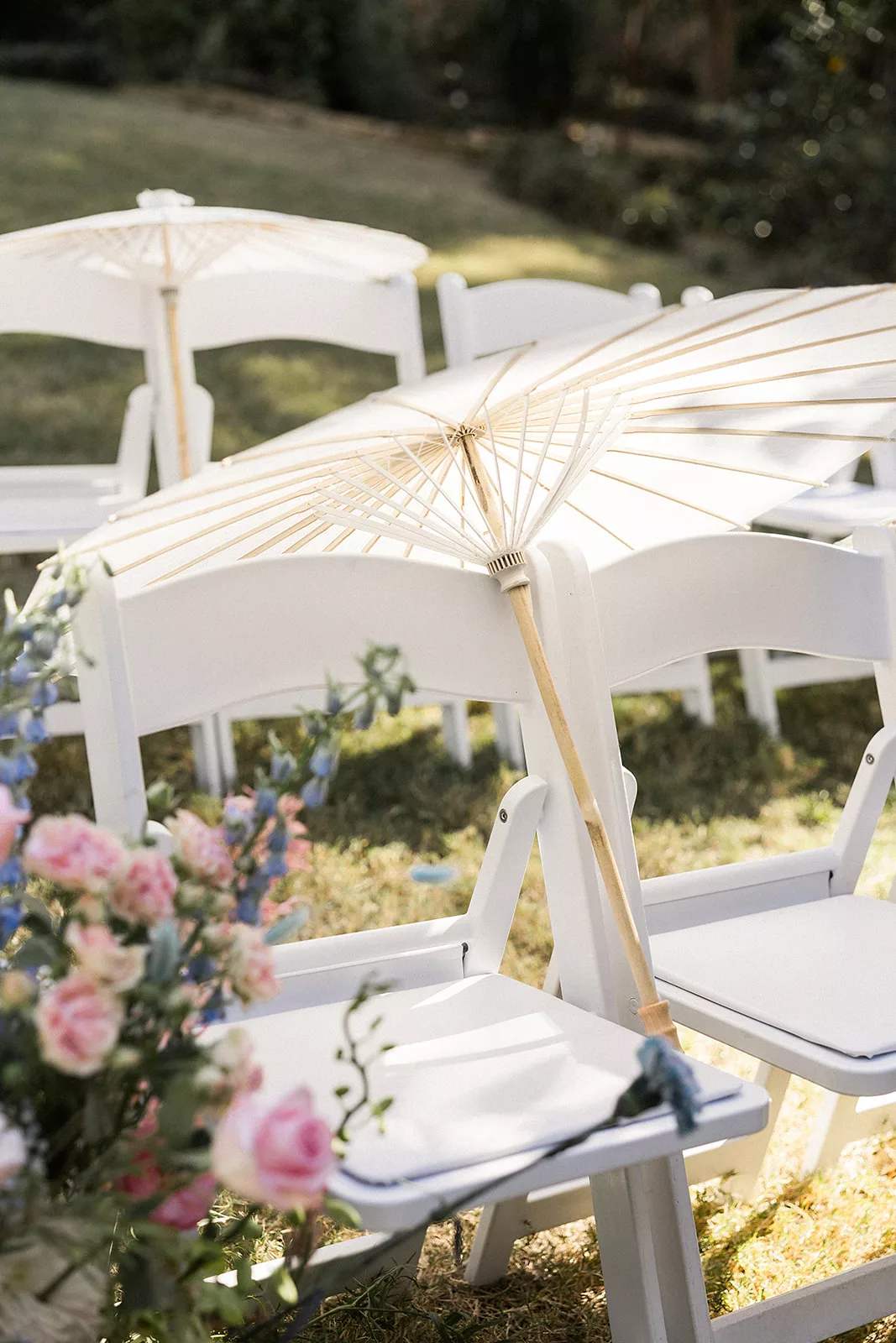 An umbrella rests on a chair in a Wildflower 301 wedding reception