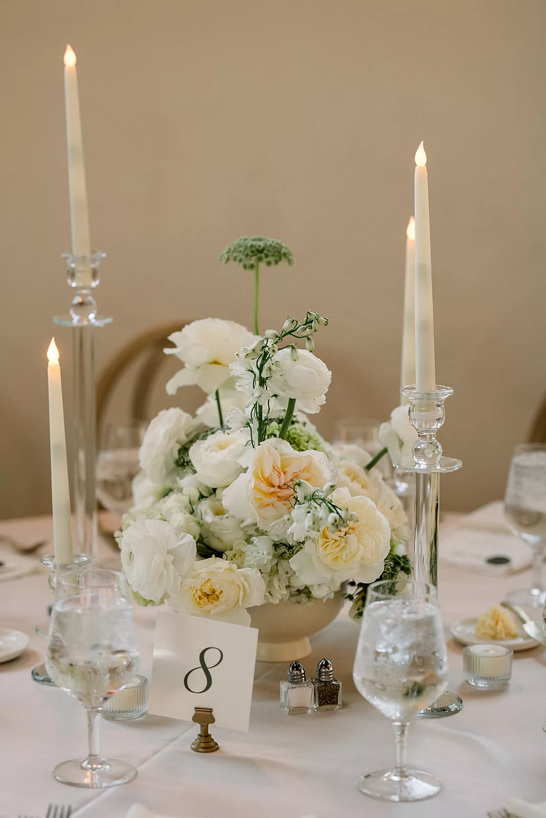 Details of a white rose centerpiece for a wedding reception