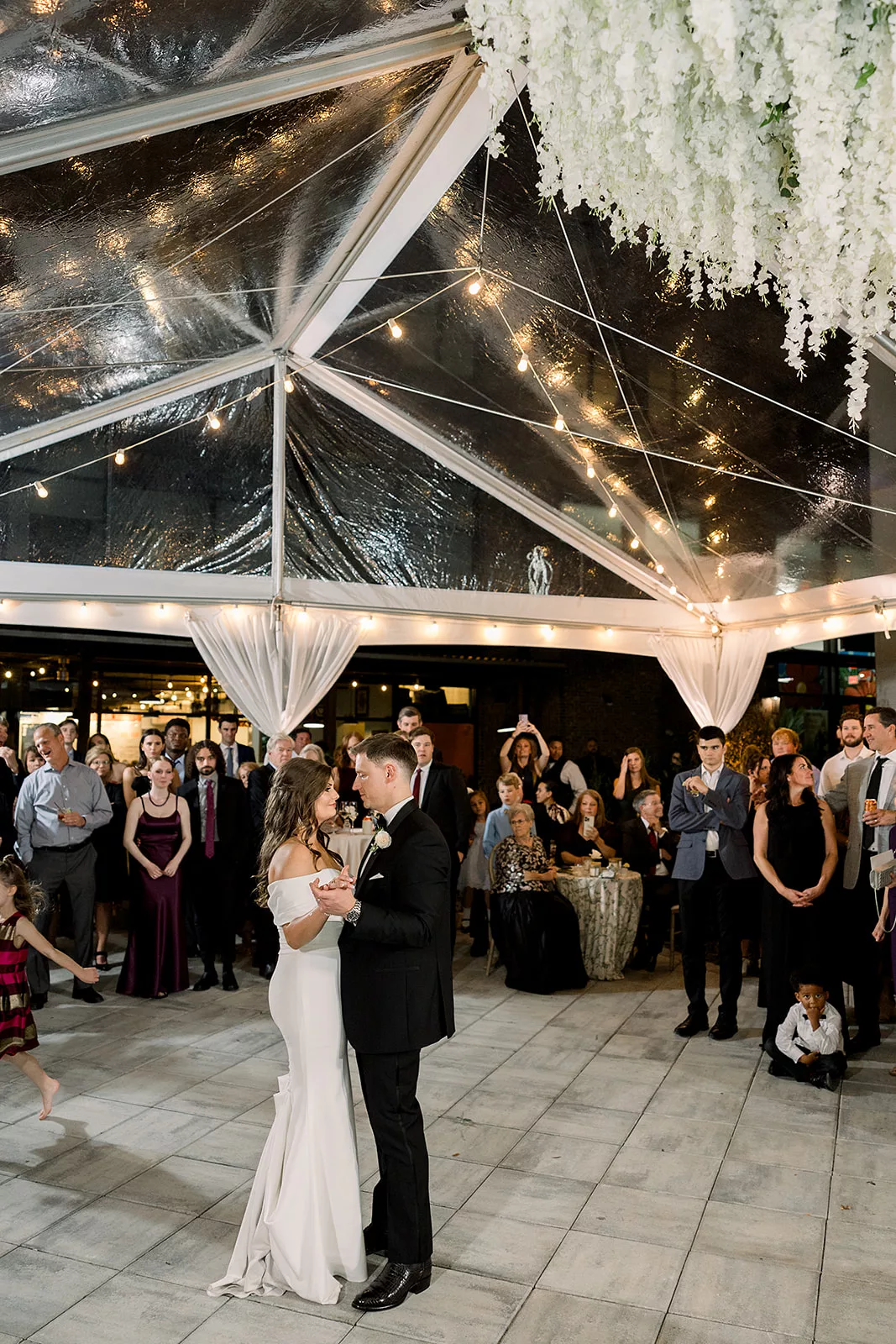 Newlyweds dance under a tent in front of their guests at The Chapel Athens