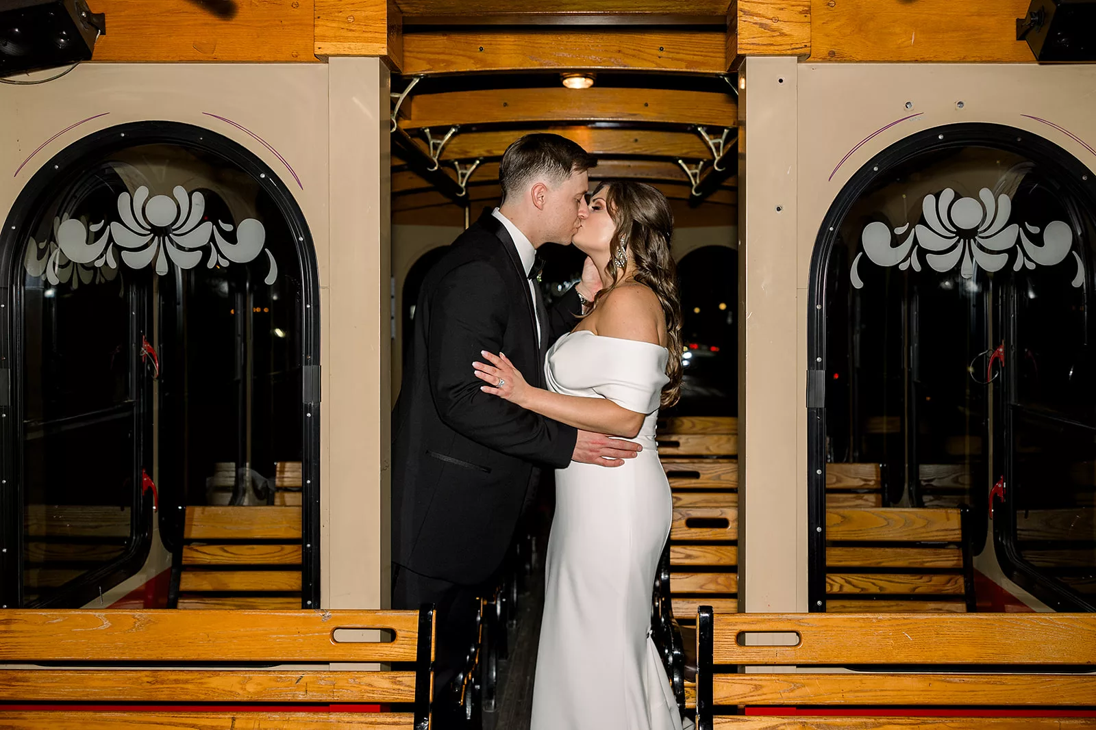 Newlyweds kiss on a trolley at their The Chapel Athens wedding